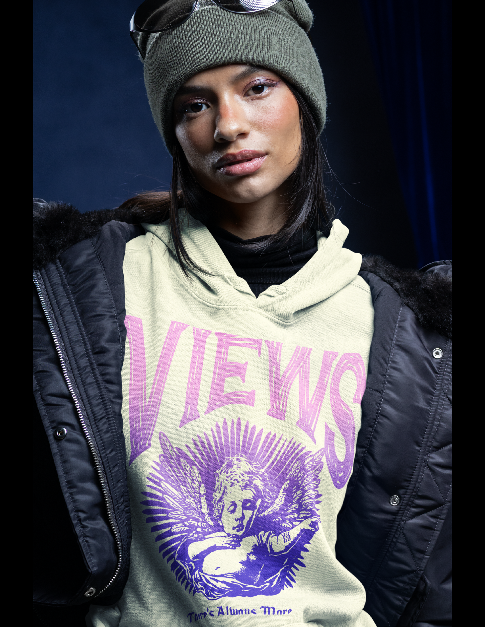 Person wearing a hoodie with 'VIEWS' text and graphic design